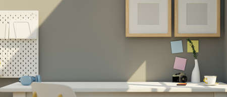 Modern minimal home office workspace with copy space and decor on white desk, blank picture frame...