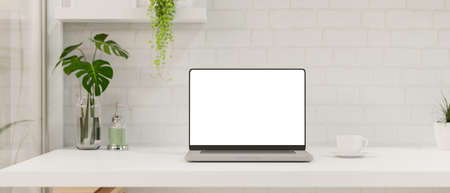 Modern minimal white office room interior with close-up laptop computer blank screen mockup and...
