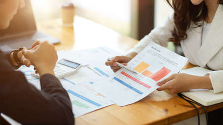 Female executive manager having a financial investment meeting with male consultant in the office. close-upの写真素材