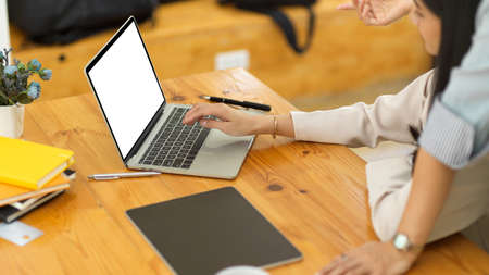 A female business colleague workers brainstorming and discussing work as a teamwork. cropped imageの写真素材