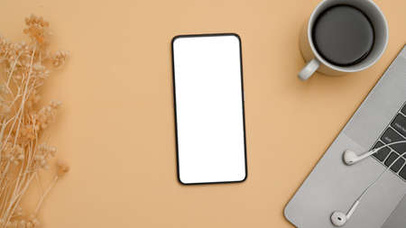 A smartphone white screen mockup for montage your graphic image, coffee cup, accessories on natural...