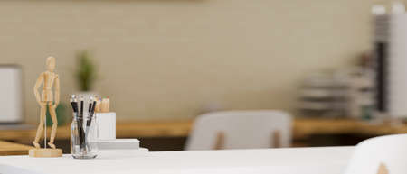 Close-up, A minimal study table with stationery, decor and copy space for montage your product display over blurred Scandinavian working room in the background. 3d rendering, 3d illustrationの写真素材