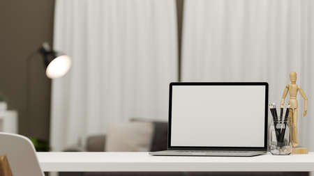 Modern home workspace interior with notebook laptop blank screen mockup, accessories and copy space for montage on table over blurred living room in the background. 3d rendering, 3d illustrationの写真素材