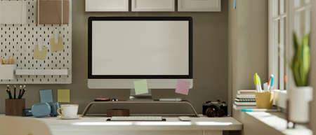 Modern home workstation or teens study table space with pc computer blank screen mockup, accessories and decor on table. 3d rendering, 3d illustrationの写真素材