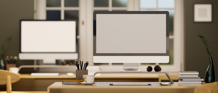 Close-up, PC desktop computer blank screen mockup on wooden table in modern office workplace...