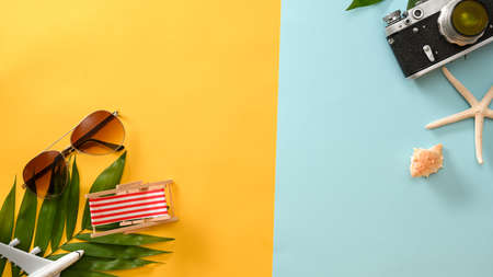 Colourful beach summer composition background with beach accessories and copy space. top viewの写真素材