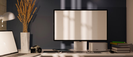 Modern office desk or home workspace studio with PC desktop computer stand on table with supplies and laptop against the grey wall. close-up, 3d rendering, 3d illustrationの写真素材