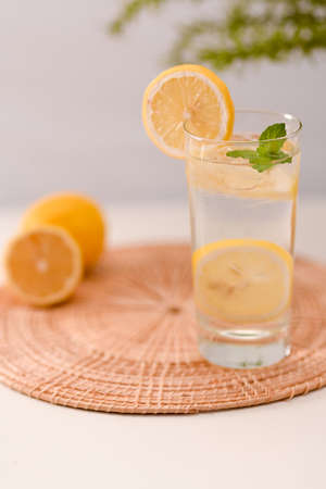 Detox drinks, Cold fresh lemonade with mint on a bamboo mat. Summer refreshing drinks.