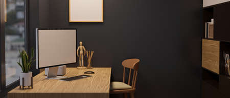 Modern black office workspace interior, PC desktop computer blank scree mockup and decors on wooden...