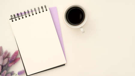 Top view, flat lay, Empty spiral notepad or school notepad for display your text is on minimal white working desk.の写真素材