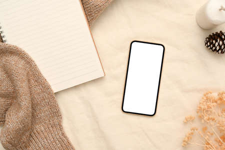 Aesthetics feminine working space background with smartphone white screen mockup and accessories.の写真素材