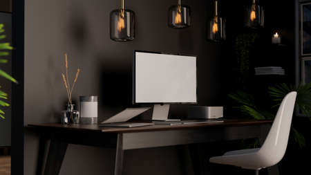 Luxury modern dark office studio workspace interior with desktop computer, laptop and decor on...