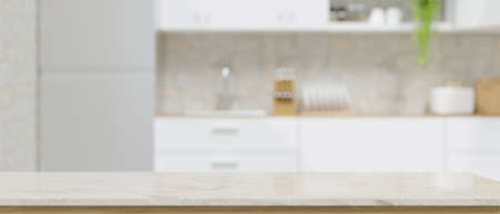 Modern marble white kitchen countertop with copy space for montage your product display over blurred apartment white kitchen interior in the background. 3d rendering, 3d illustrationの写真素材