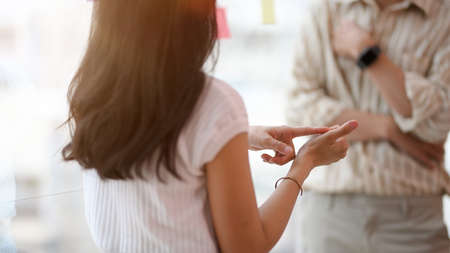Cropped and close-up image, Professional female boss complain the business problem with her male assistant.の写真素材