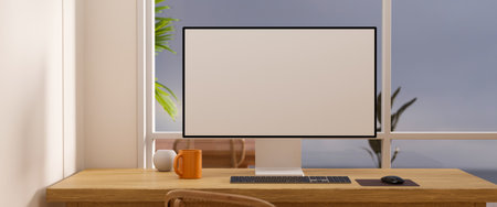 Comfortable workspace with pc computer blank screen mockup, coffee mug, keyboard and accessories on...