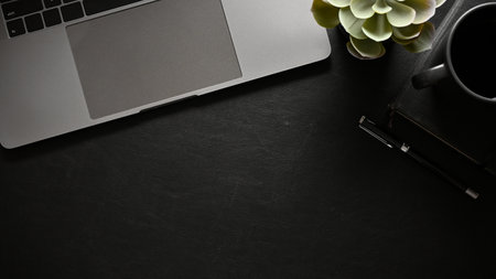 Overhead shot, A copy space for display your text or presentation background in modern black workspace tabletop with laptop and office accessories.の写真素材