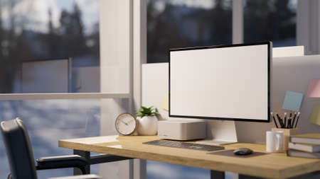 Close-up, Office desk workstation near the window with computer blank screen mockup, and office...