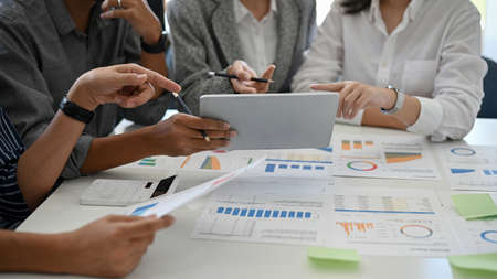 A team of professional financial consultant discussing and brainstorming a financial investment plan...