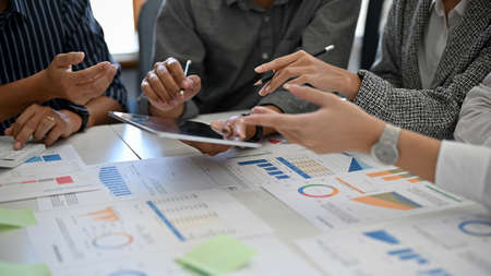 A team of business accountant having a meeting, planning and brainstorming a new investment budget...