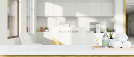 Copy space for product display with towels, lotion bottle and aroma diffuser on the white tabletop over blurred spa or hotel lobby in the background. 3d rendering, 3d illustrationの写真素材