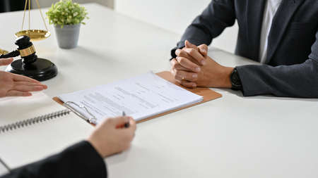 Cropped image, A professional female lawyer or legal business consultant counsels and meets with her...