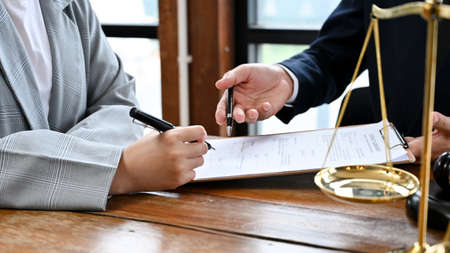 Business law consultant or lawyer having a meeting to discuss the plan with a businessman. cropped imageの写真素材