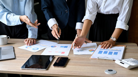 Professional and smart businesspeople in the meeting, brainstorming and analyzing a marketing sales...