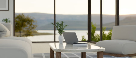 Modern and comfortable home living room with beautiful lake view through the window interior design with comfortable couch, laptop on minimal white coffee table and decor. 3d render, 3d illustrationの写真素材