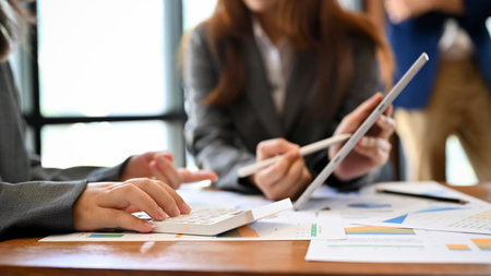 A talented Asian businesswoman presents a financial investment plan to her female boss in the meeting. cropped imageの写真素材