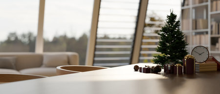 Empty space on modern wood dining table with Christmas tree, gift boxes and decor over blurred modern living room in the background. 3d render, 3d illustrationの写真素材