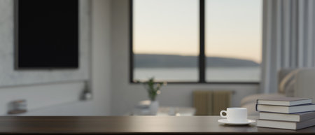 close-up image, Modern workspace wood tabletop with a cup of coffee, books and copy space for montage your product display over blurred living room background. 3d render, 3d illustrationの写真素材