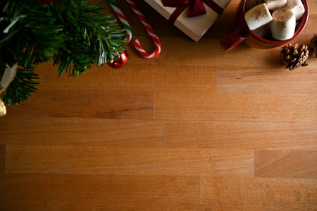 Christmas background top view, copy space for product or text display on wooden tabletop with Christmas decor.の写真素材
