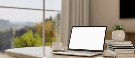 Close-up, Home workplace with notebook laptop white screen mockup, stack of books, coffee cup and...