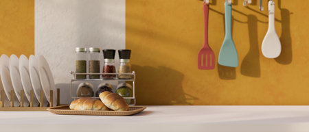 Trendy cooking space close-up, a basket bread, seasoning shelves, plates, spatulas and copy space for your product display on white tabletop over yellow background. 3d rendering, 3d illustrationの写真素材