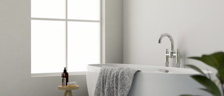 Modern elegance white bathroom interior design with luxury bathtub, towel, indoor plant, bath...