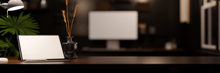 Modern dark office workplace with digital tablet white screen mockup with wireless keyboard, vase and copy space for montage your product display on dark wood tabletop. 3d rendering, 3d illustrationの写真素材