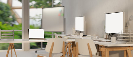 Modern minimal office co-working room interior design with PC computers and laptop white screen...