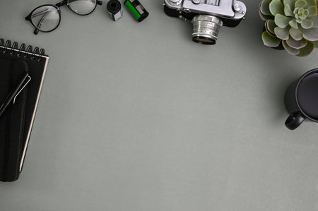 Modern workspace top view with copy space for display your text on grey background surrounded with accessories.の写真素材