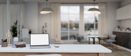 Modern white home office workspace with laptop white screen mockup and accessories on table in modern white kitchen with dining table. 3d render, 3d illustrationの写真素材