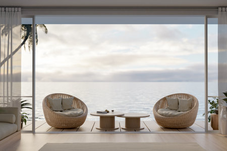 Luxury and beautiful villa outdoor relaxation lounge on terrace design with wicker beach chairs, a coffee table, and a beautiful ocean view. 3d render, 3d illustrationの写真素材