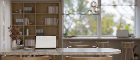Laptop white screen mockup, decor and copy space on a tabletop in comfortable and minimal co-working...