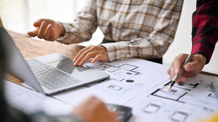 Close-up image of a team of professional engineer are in the meeting to discuss and plan a building...