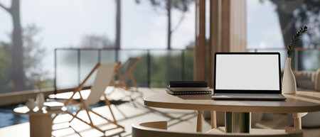 close-up image, Workspace with laptop computer white screen mockup, books and flower vase on a...