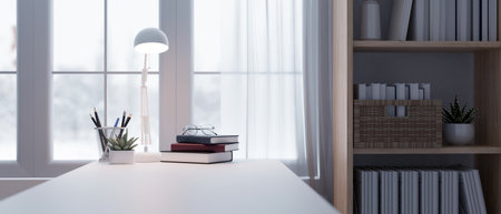 Close-up rear view image of a copy space on a white tabletop with books, glass, potted plant, table lamp, and stationery in a modern bright office room. 3d render, 3d illustrationの写真素材