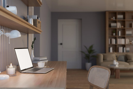 Close-up rear view image of a laptop white screen mockup on a minimal wooden table in a modern, contemporary, and cozy apartment living room. Home workspace concept. 3d render, 3d illustrationの写真素材