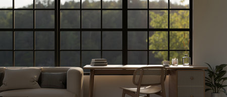 A minimal table with a wooden chair against the window in a beautiful and cozy living room. Home...