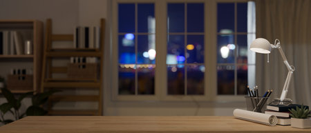 Copy space for displaying your product display on a wooden desk with a table lamp, blueprint roll,...