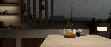 Close-up image of a modern kitchen island or kitchen countertop with a coffee cup, a bread basket, a...