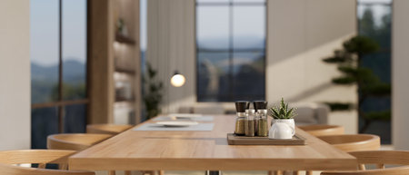 Close-up image of copy space on a minimal wooden dining table with seasoning bottles, a coffee cup,...