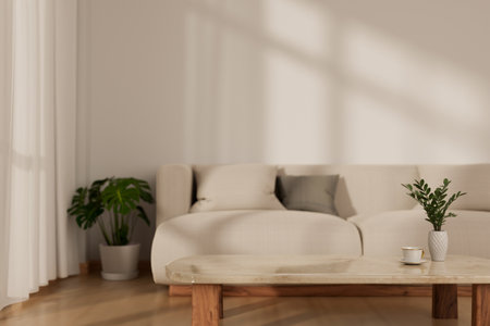 A modern minimalist living room interior design with a comfortable white couch, a coffee table, an indoor plant, a parquet floor, and a white wall. 3d render, 3d illustrationの写真素材